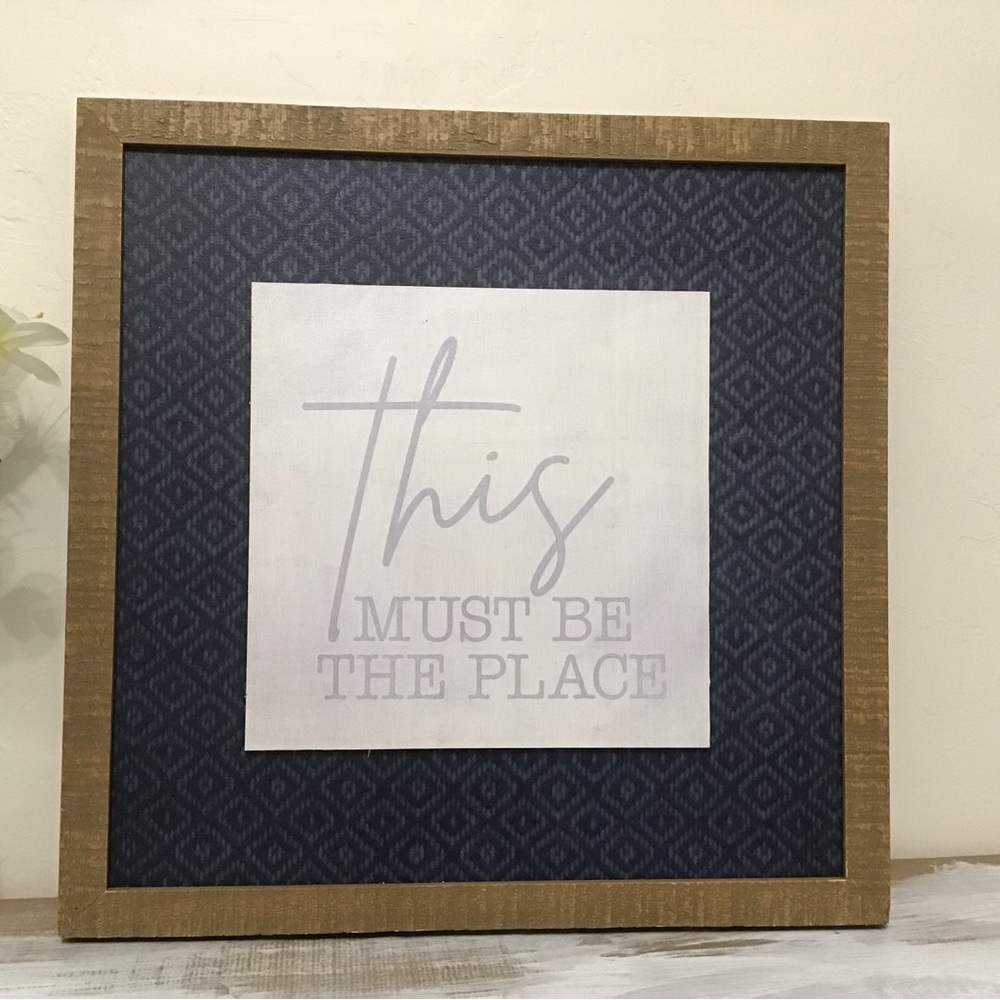 Kirkland’s “This Must Be The Place” Framed Wall Hanging | Navy Patterned Mat |
